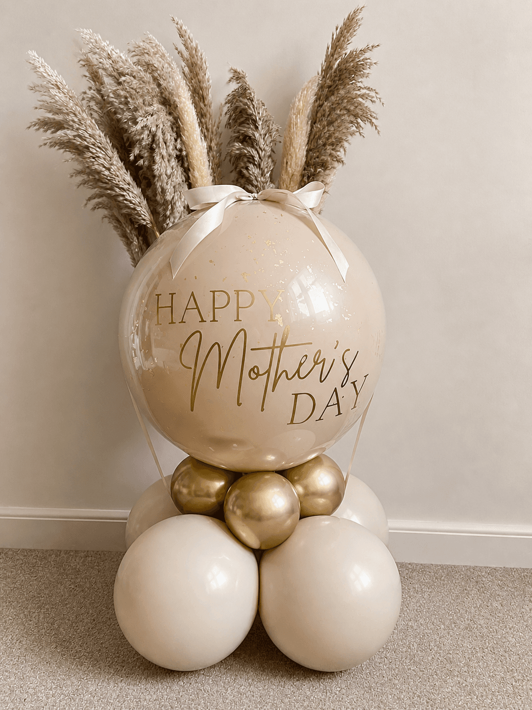 Intimate Jovira styling with a soft balloon cluster above a dressed celebration table
